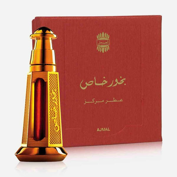 Gold perfume bottle with red box on a white background
